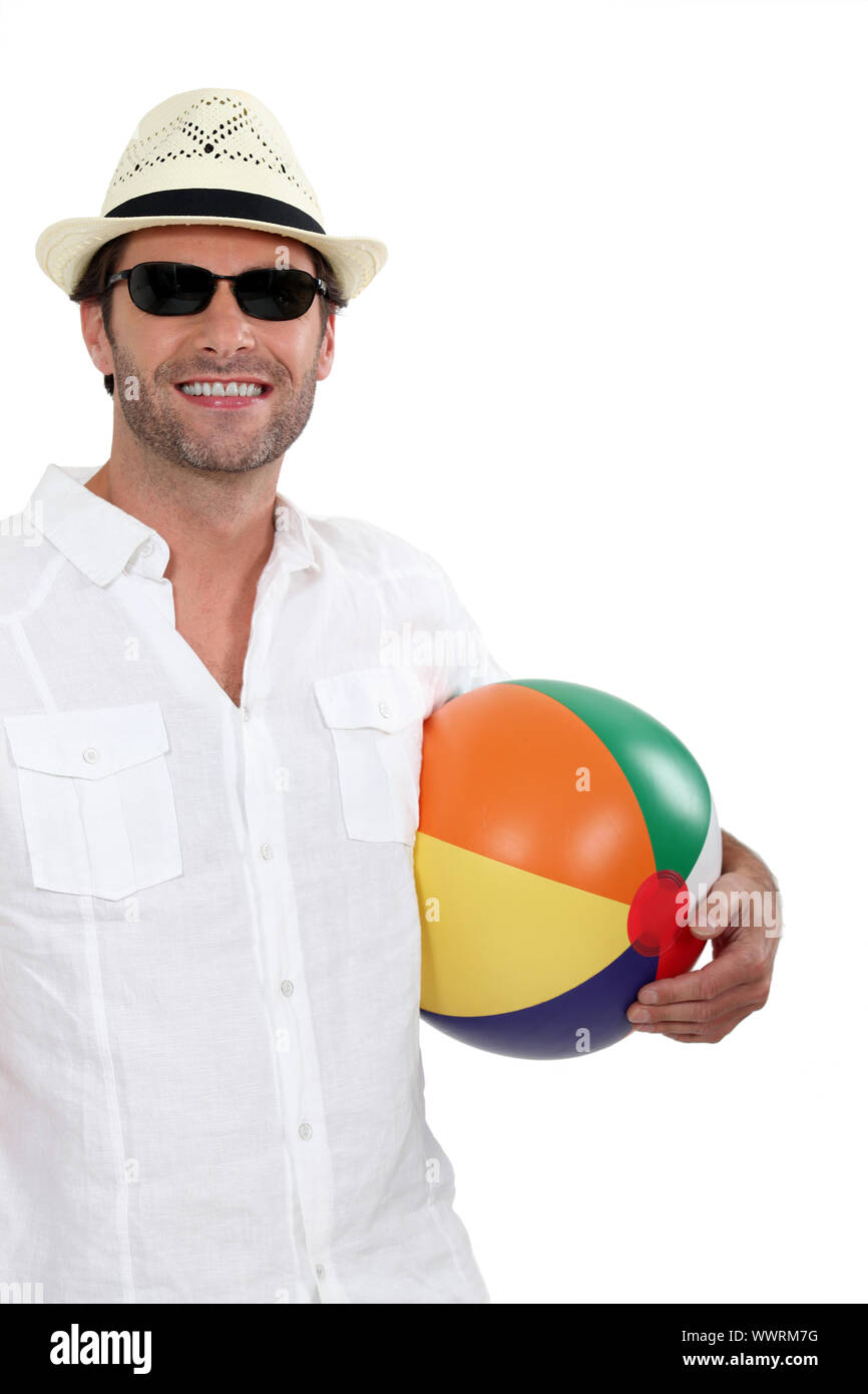 Man holding beach ball Stock Photo Alamy