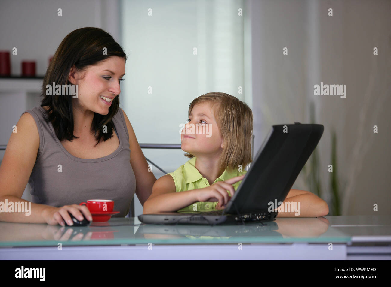Mother and daughter using a  laptop Stock Photo