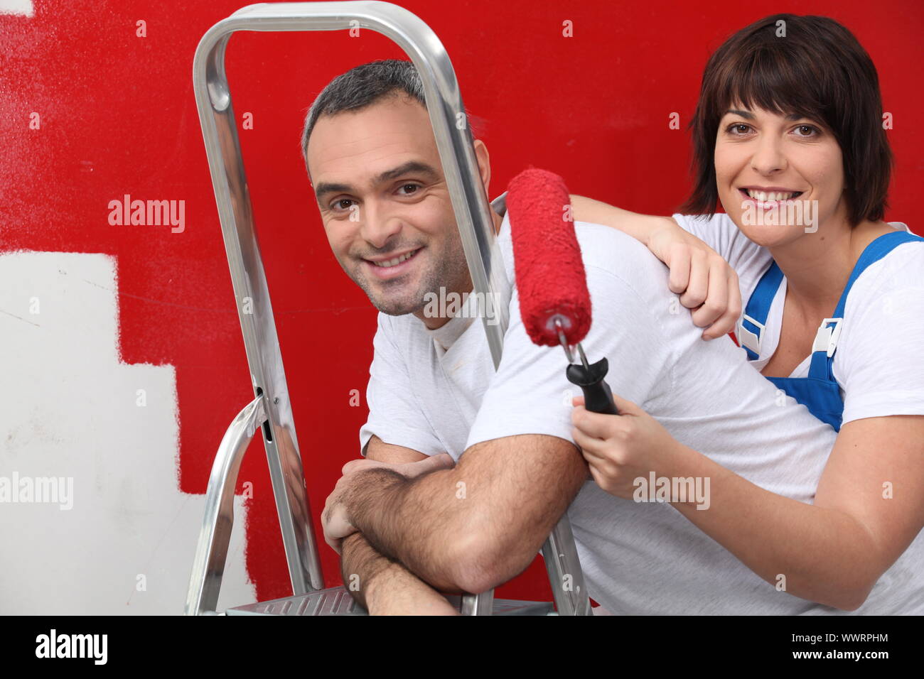 couple repainting their apartment Stock Photo