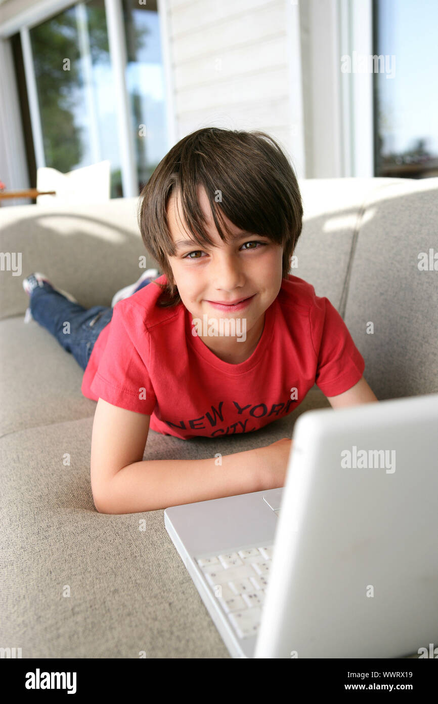 Young boy using a laptop Stock Photo