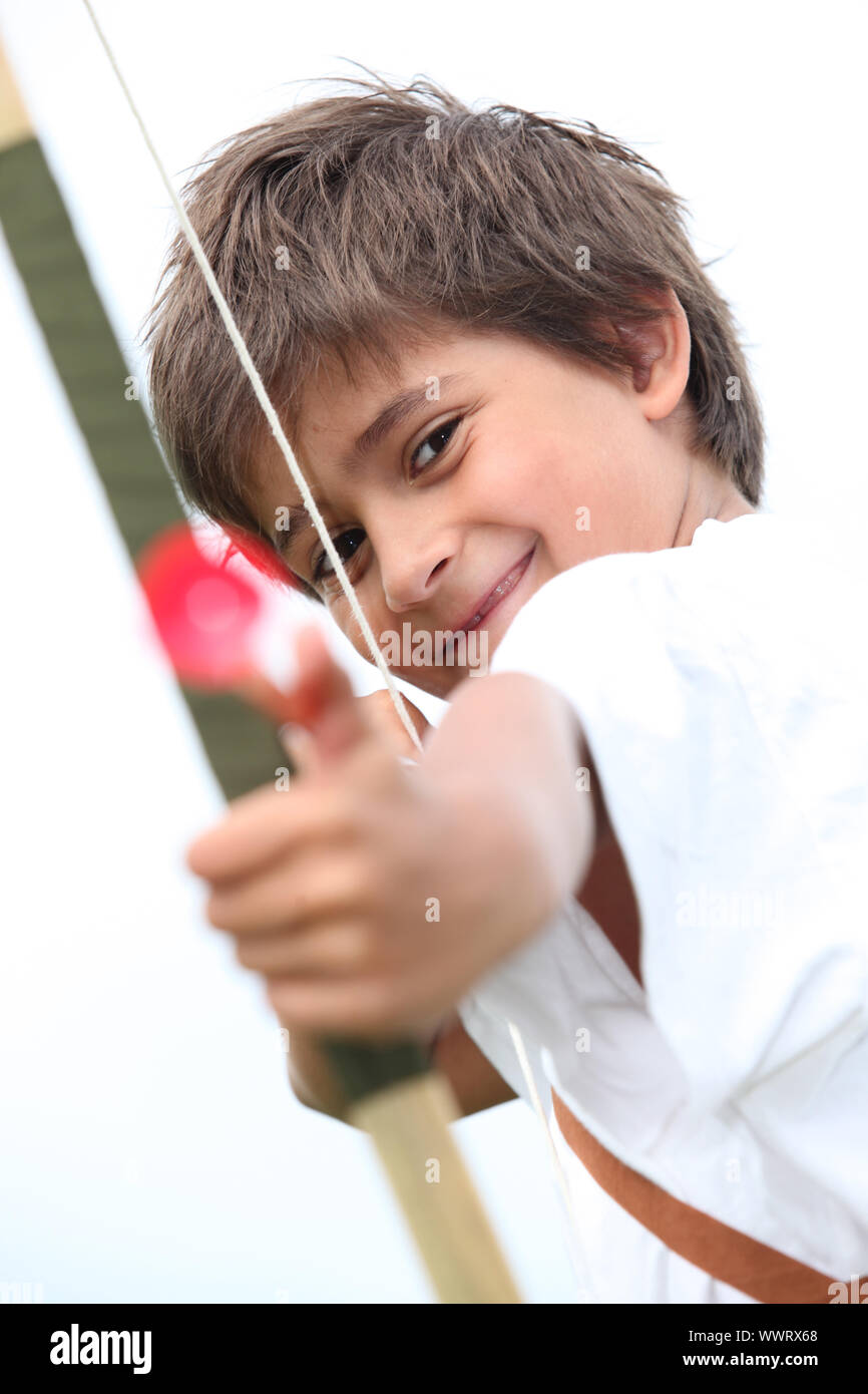 Little boy with bow and arrow Stock Photo Alamy
