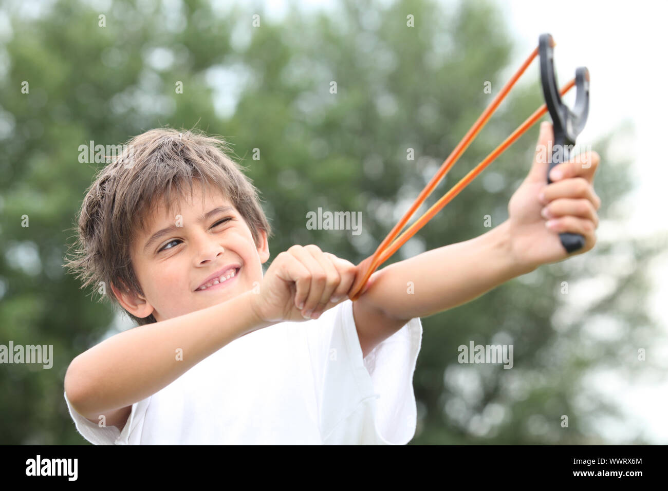 Boy with slingshot Stock Photo Alamy