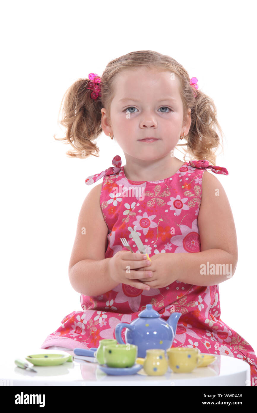 Little girl having tea Stock Photo - Alamy