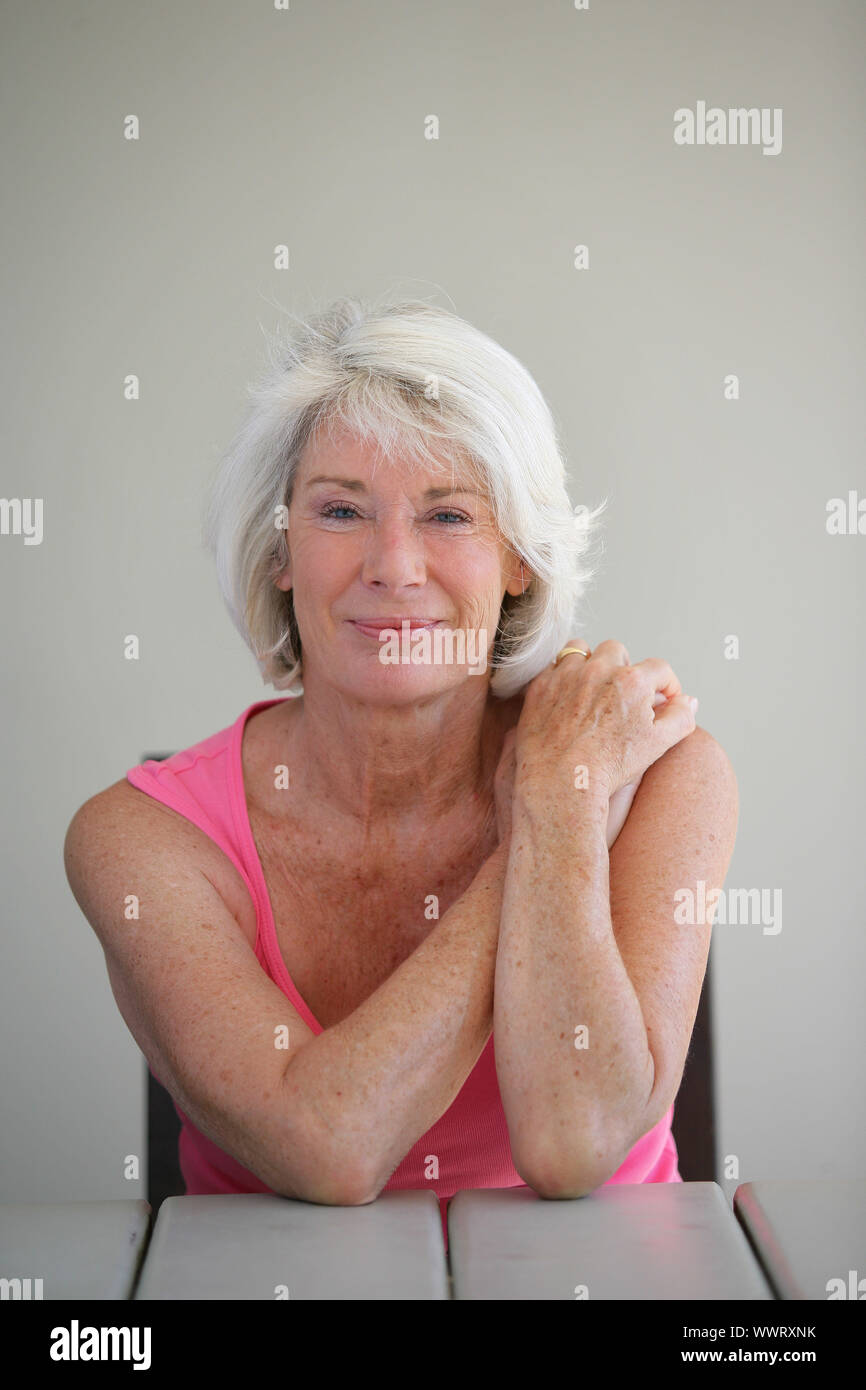 Senior woman sitting veranda hi-res stock photography and images - Alamy