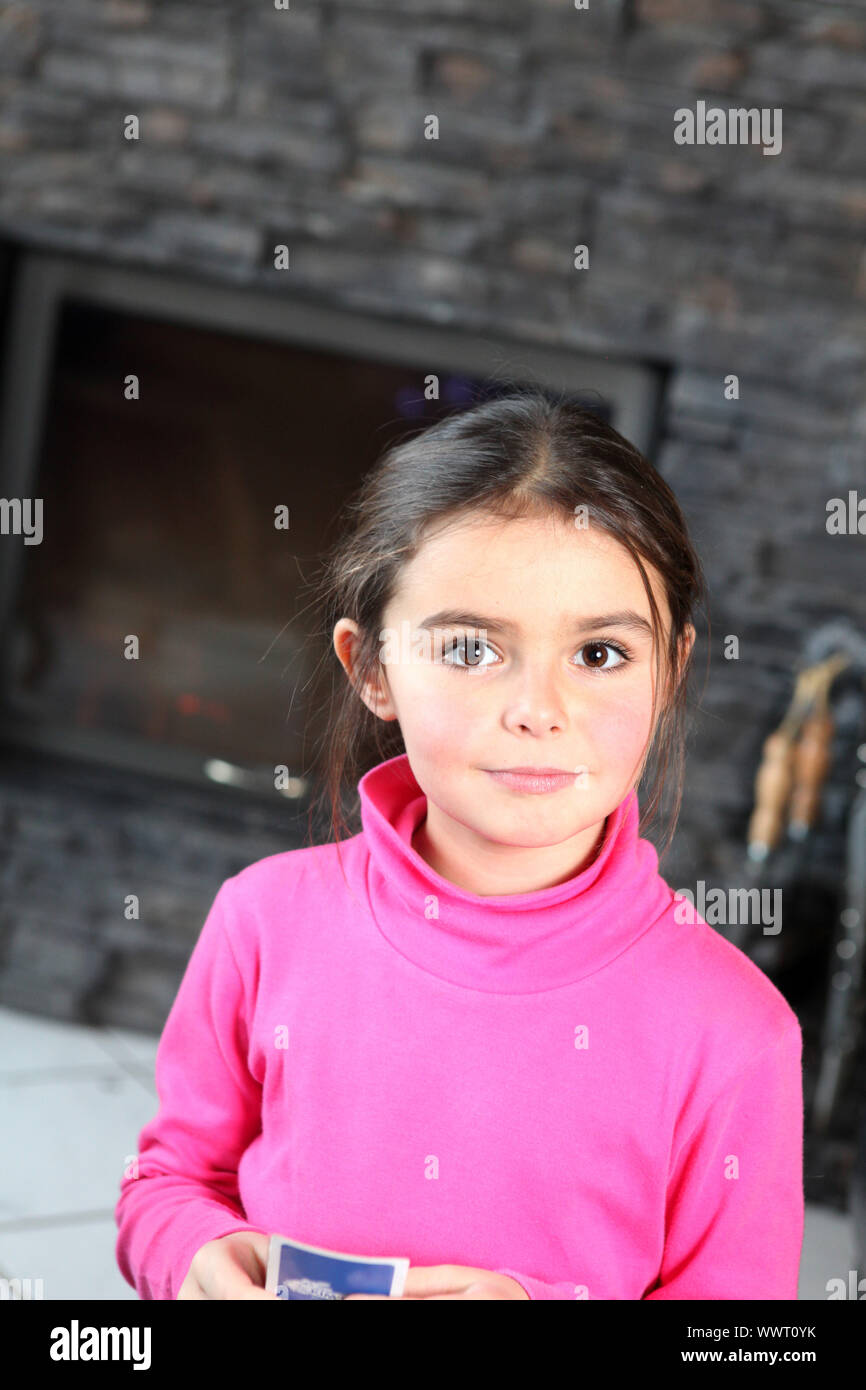 Little girl playing card game alone Stock Photo Alamy