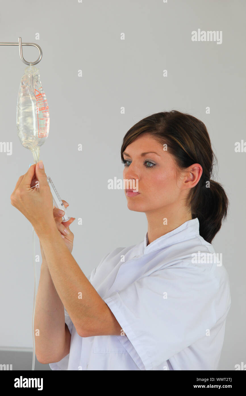 nurse injecting a product Stock Photo