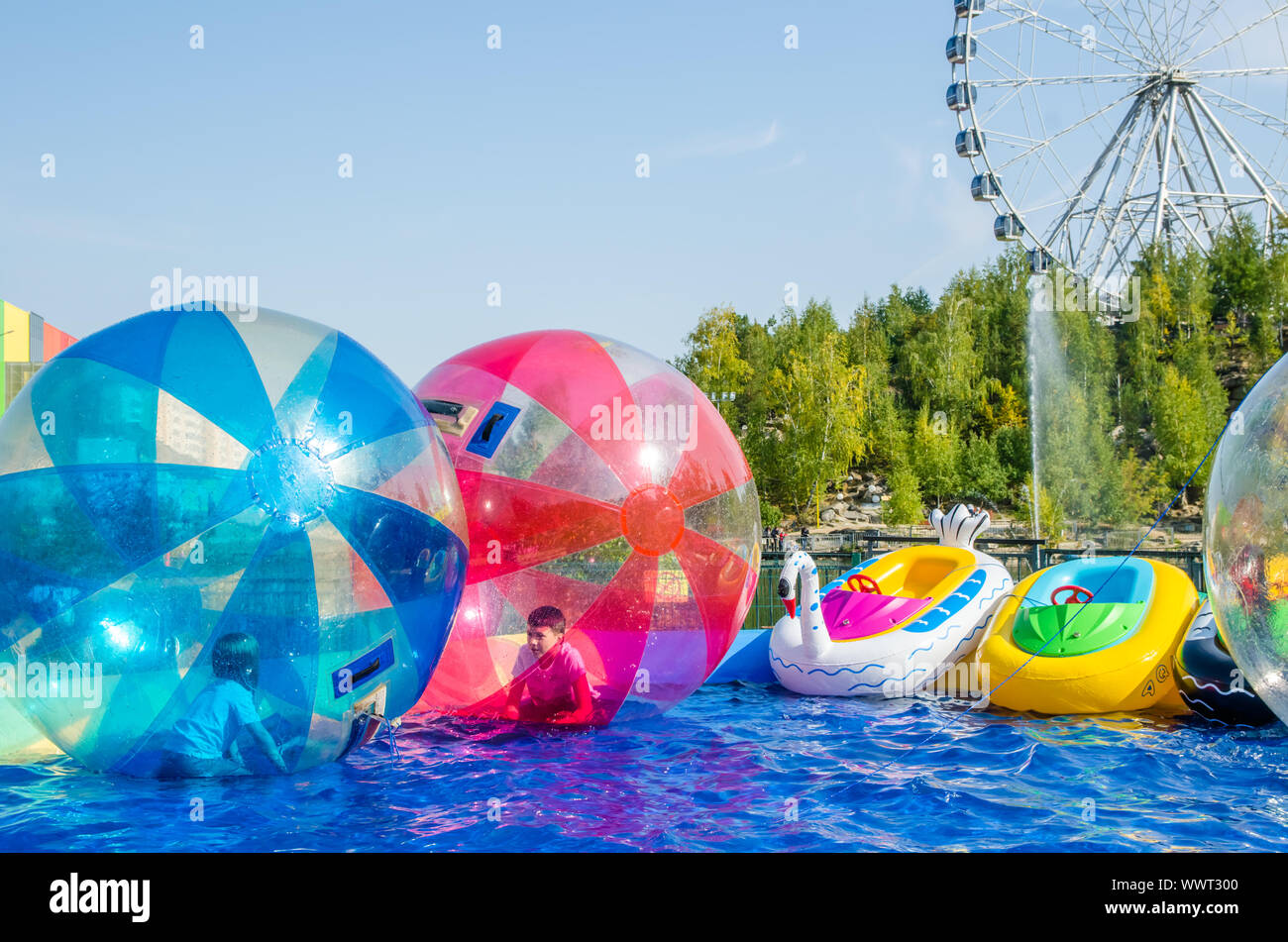 kids in water balloons zorb on the water Stock Photo Alamy
