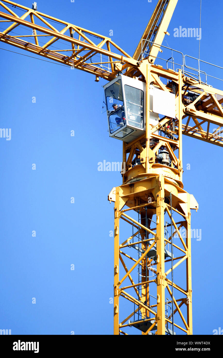 Man operating a crane Stock Photo - Alamy