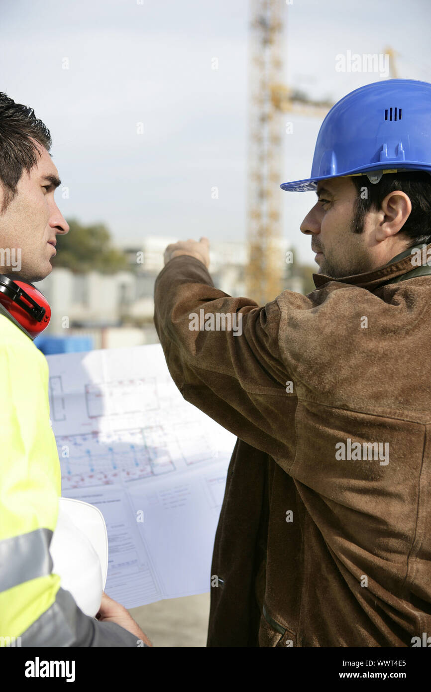 Workers on a construction site Stock Photo