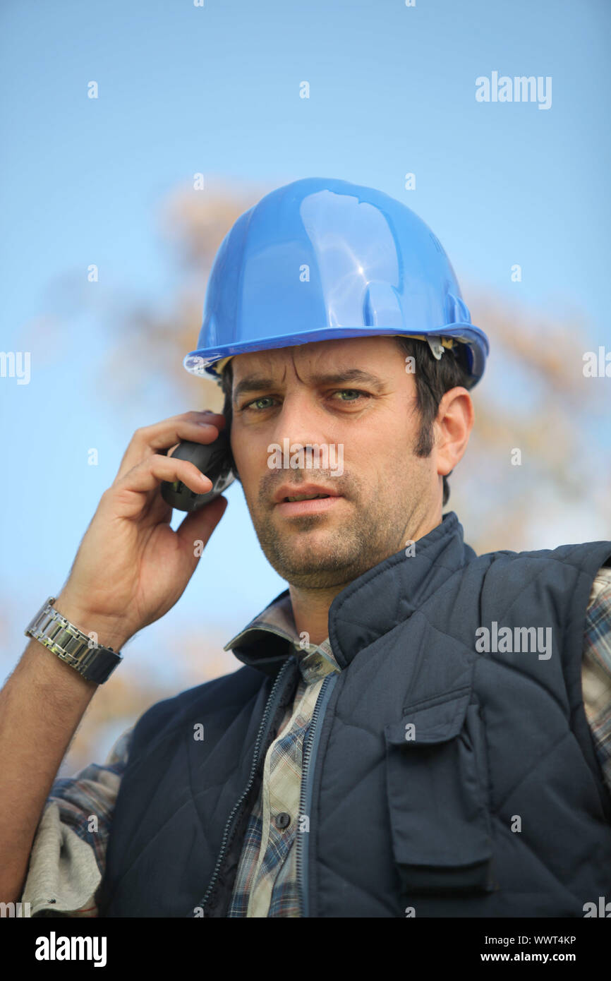foreman in construction site making a call Stock Photo