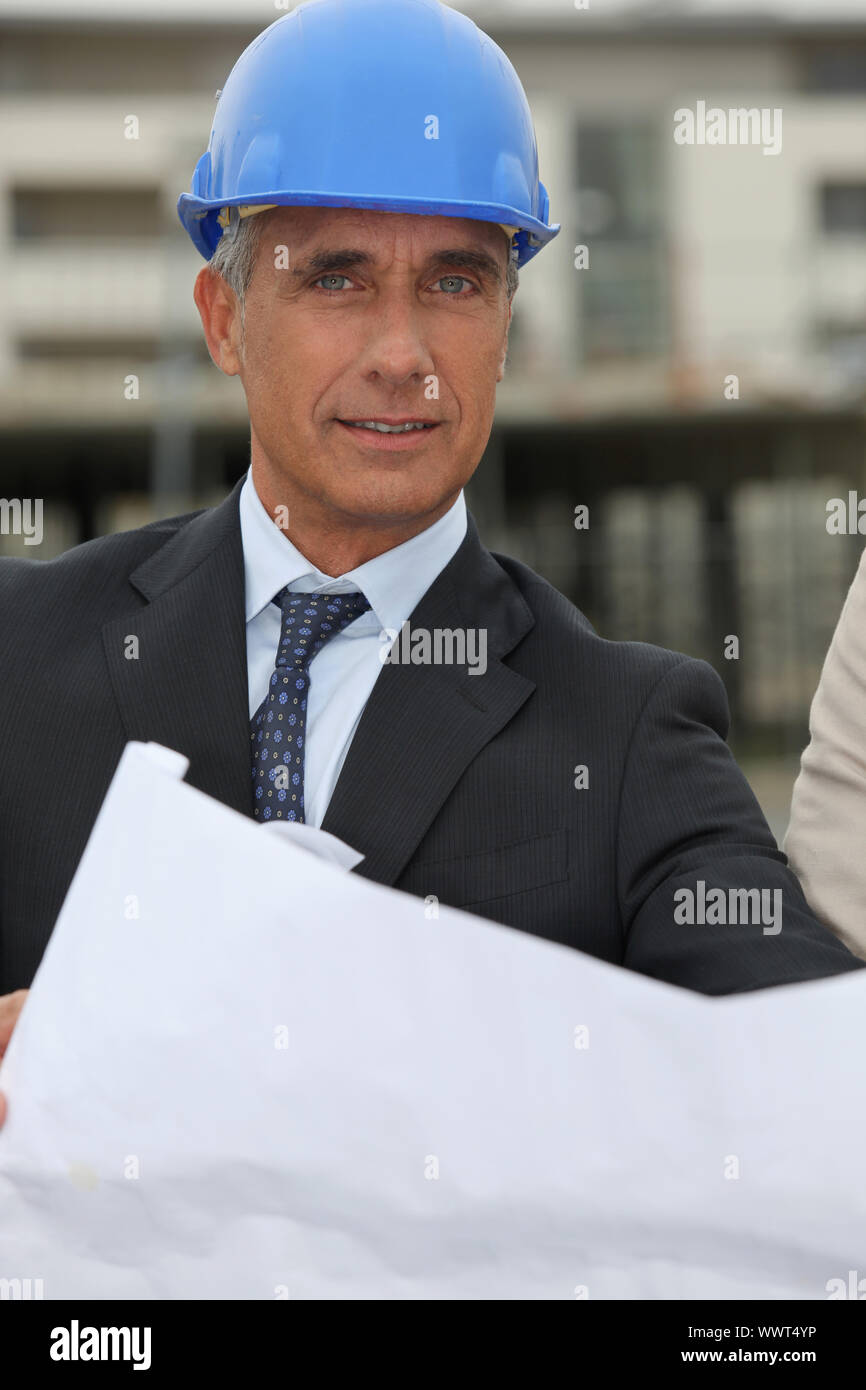 Senior architect working on-site Stock Photo