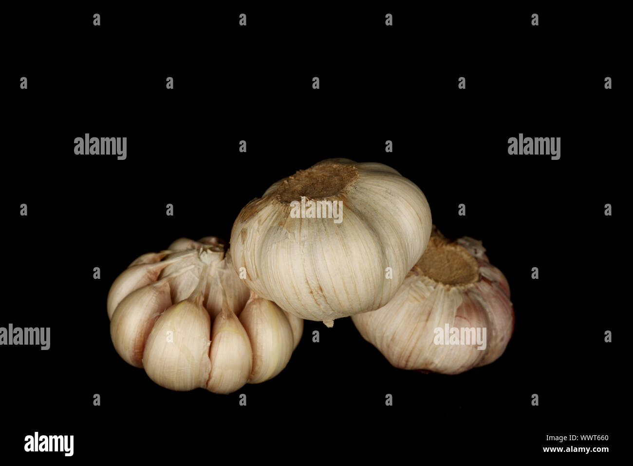 garlic isolated on black background Stock Photo - Alamy