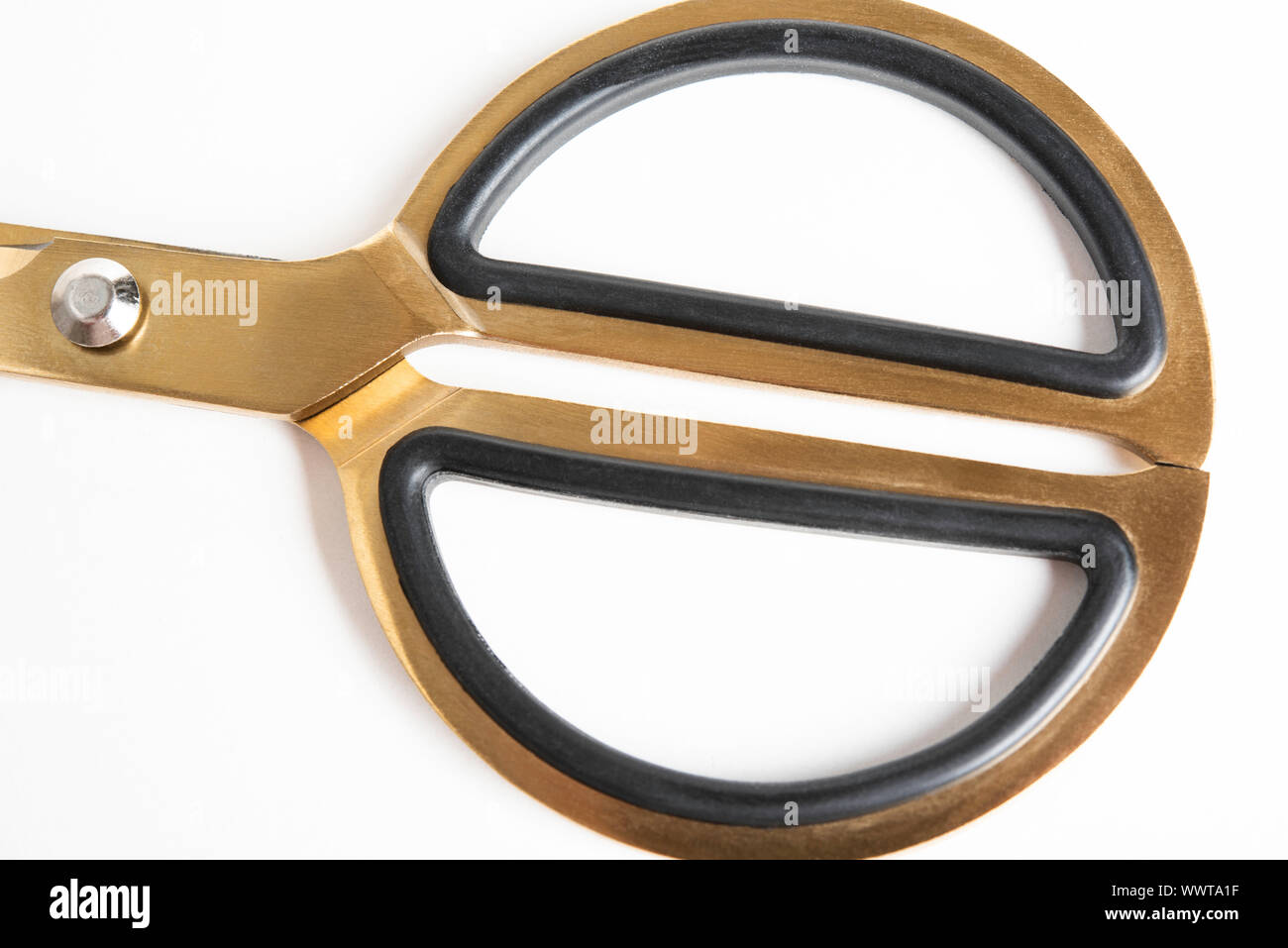 A close-up detailed studio product view of the circular handle of a vintage style pair of scissors. Stock Photo