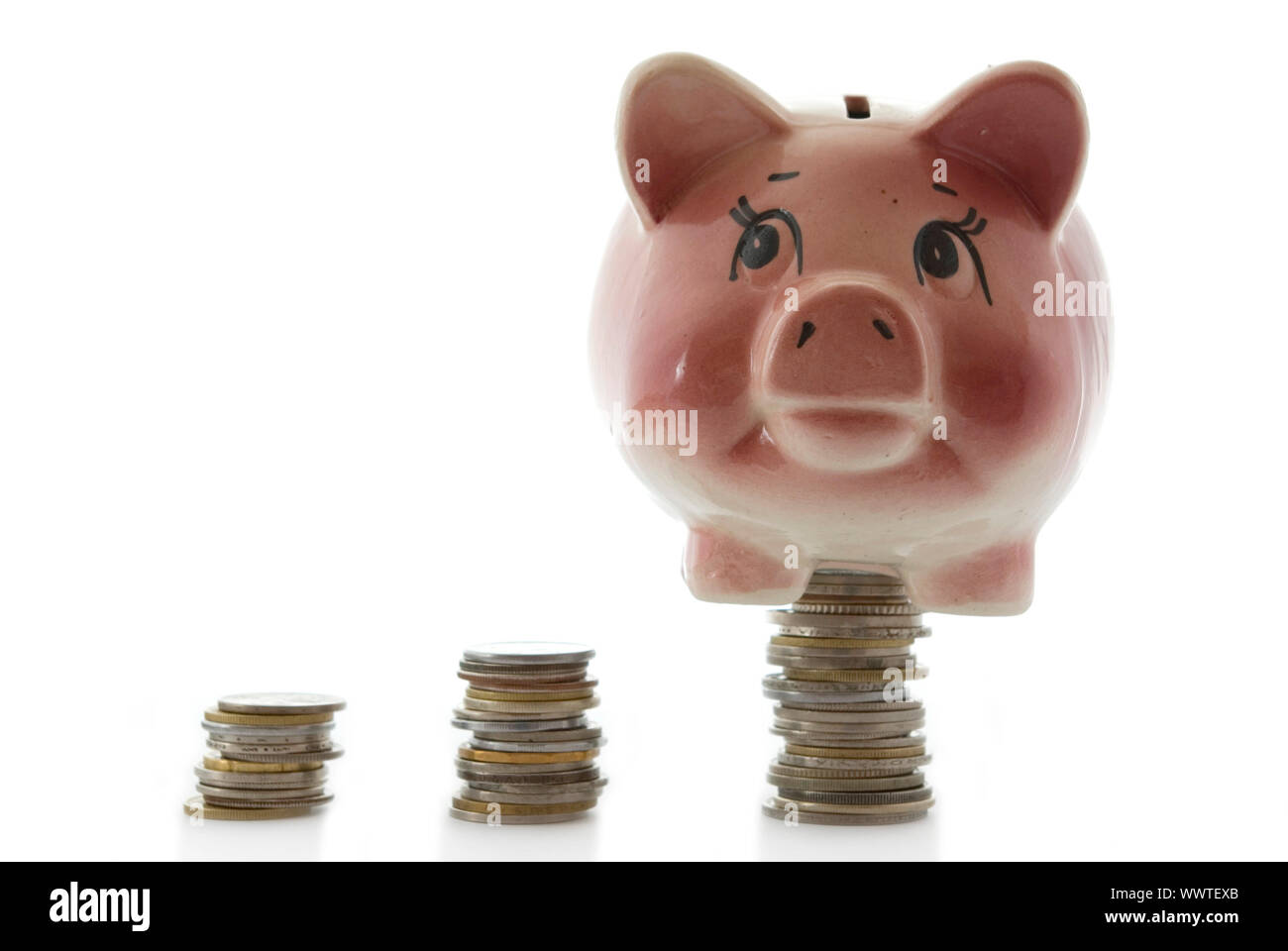 Pink piggy bank isolated on white background with coins Stock Photo - Alamy