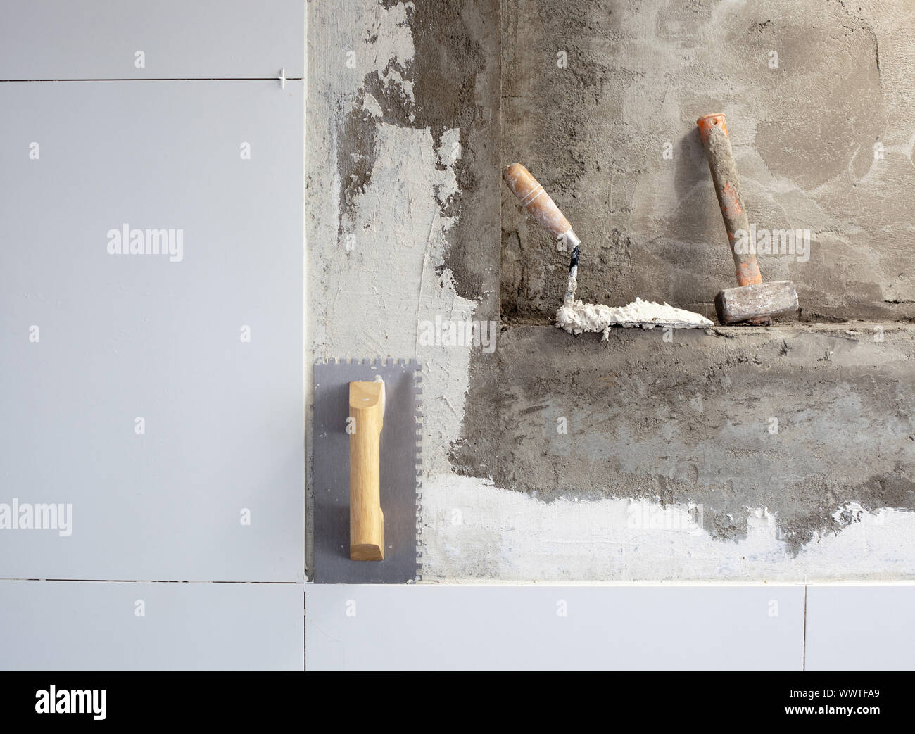 construction tools notched trowel on tiles mortar wall Stock Photo Alamy