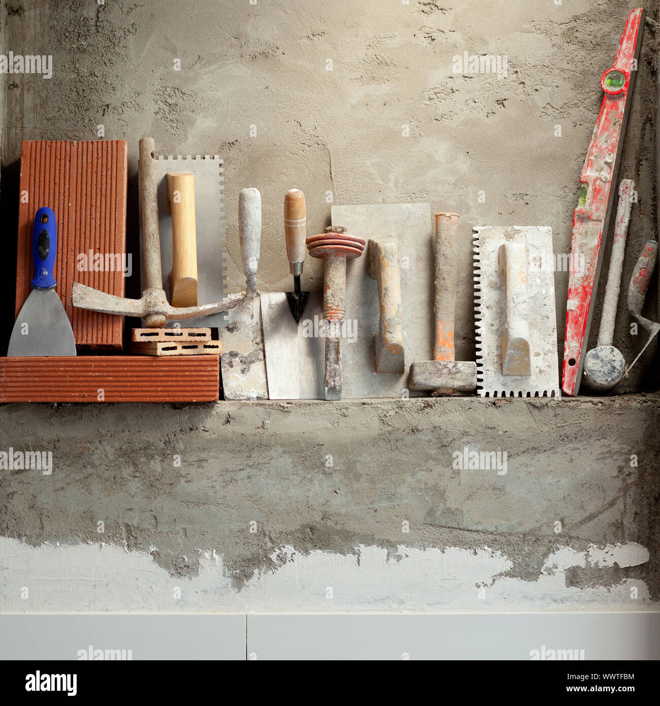 Construction mason cement mortar tools in a row Stock Photo - Alamy