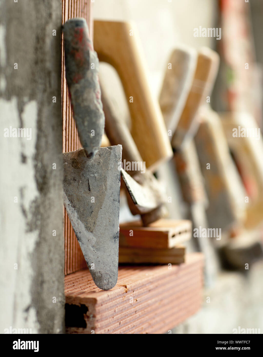 Construction mason cement mortar tools in a row Stock Photo - Alamy