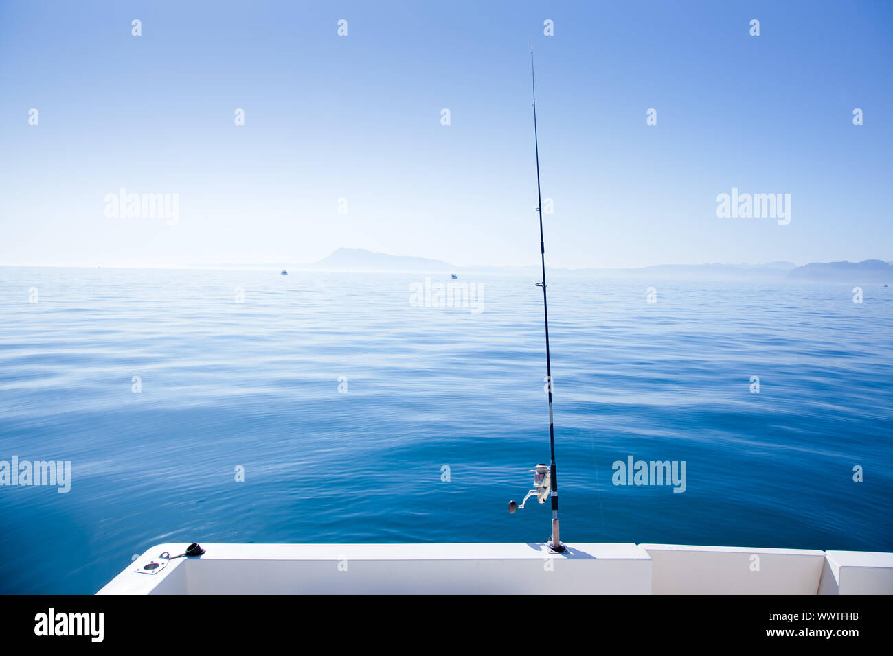 boat fishing rod in mediterranean blue sea in Spain Stock Photo