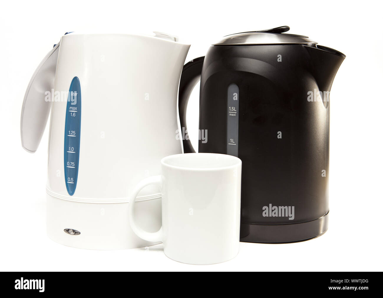 two electric tea kettle on a white background and a mug. Stock Photo