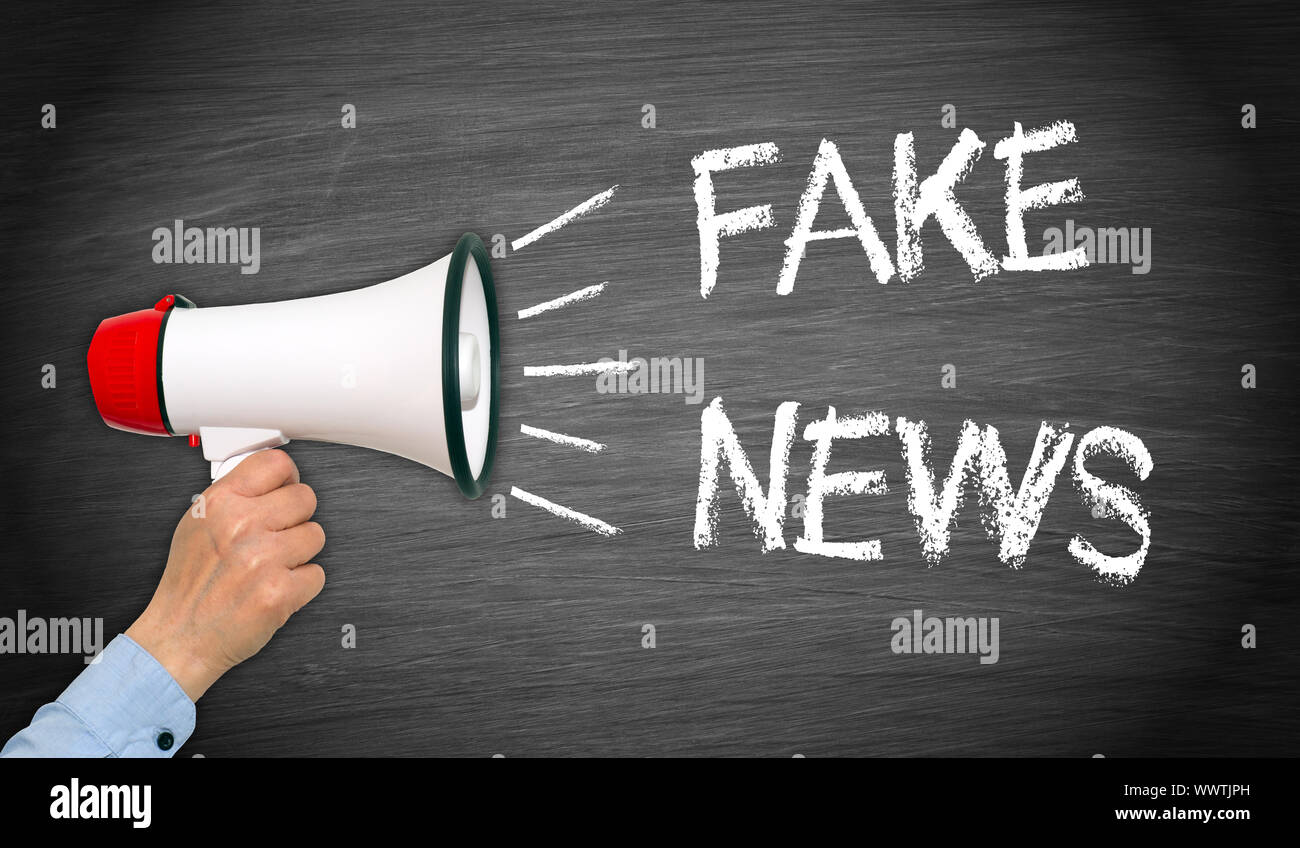 Fake News - Megaphone with hand Stock Photo - Alamy
