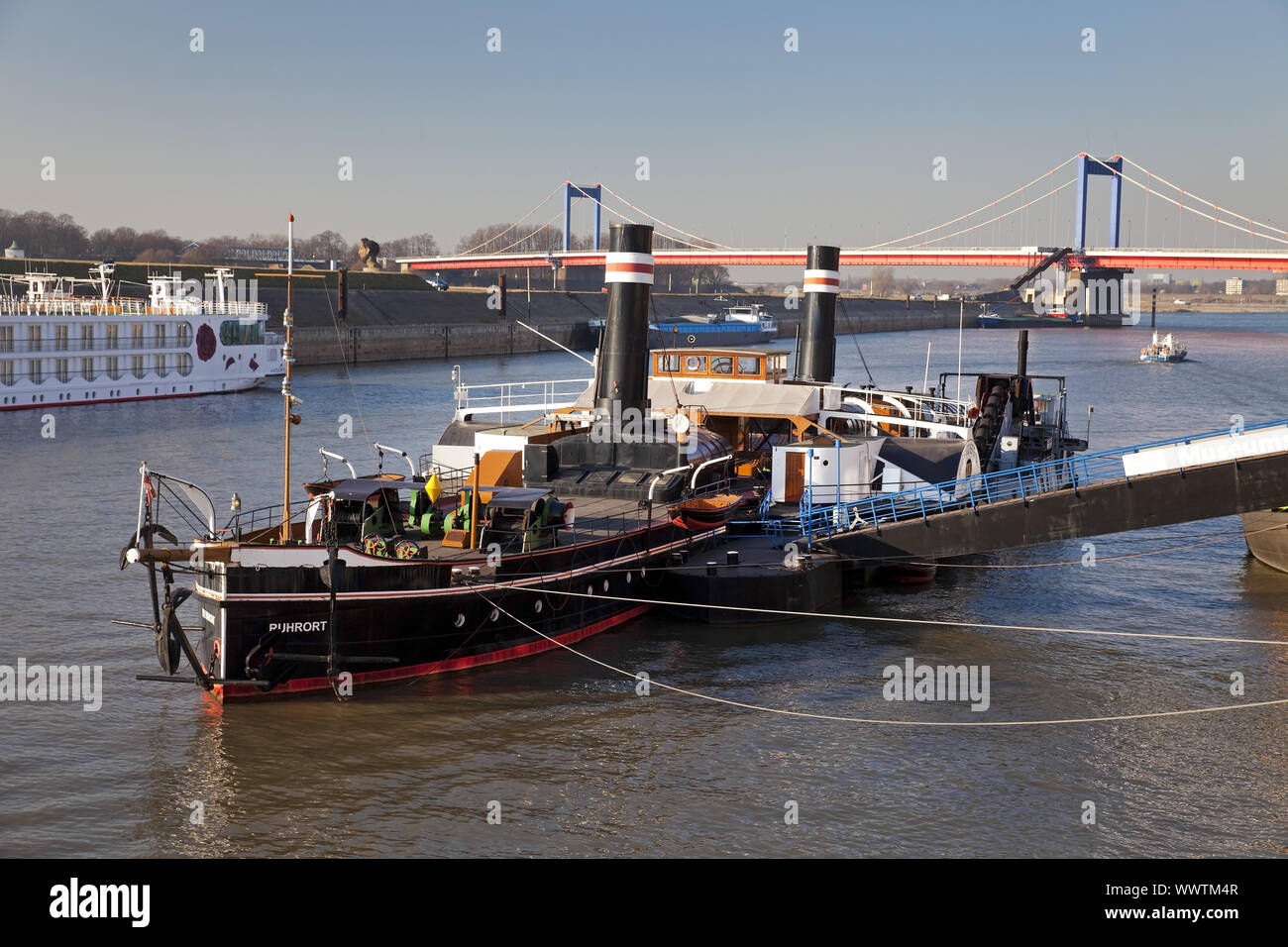 museum ship Oskar Huber and brigde Friedrich-Ebert-Bruecke over the river Rhine, Duisburg, Germany Stock Photo