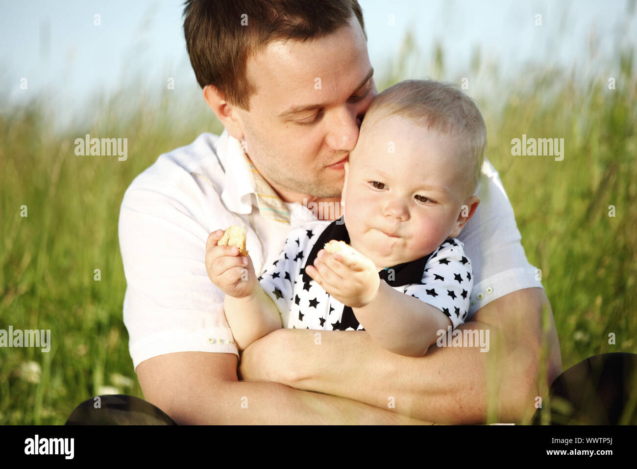father and son in the grass Stock Photo - Alamy