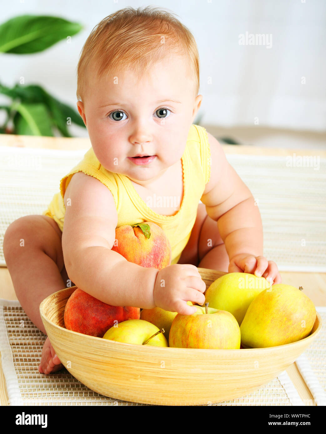 Little baby choosing fruits Stock Photo - Alamy