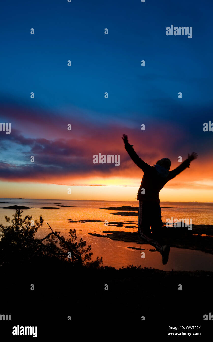 Girl jumping sky ocean in hi-res stock photography and images - Alamy