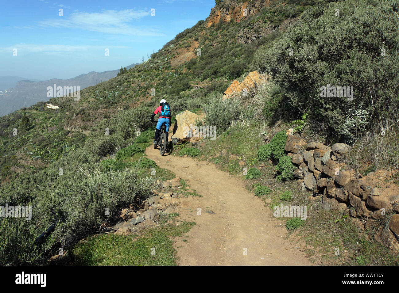 mountain biker on the hiking trail from Cruz Lanos de la Pez to La Culata and la Goleta Stock Photo