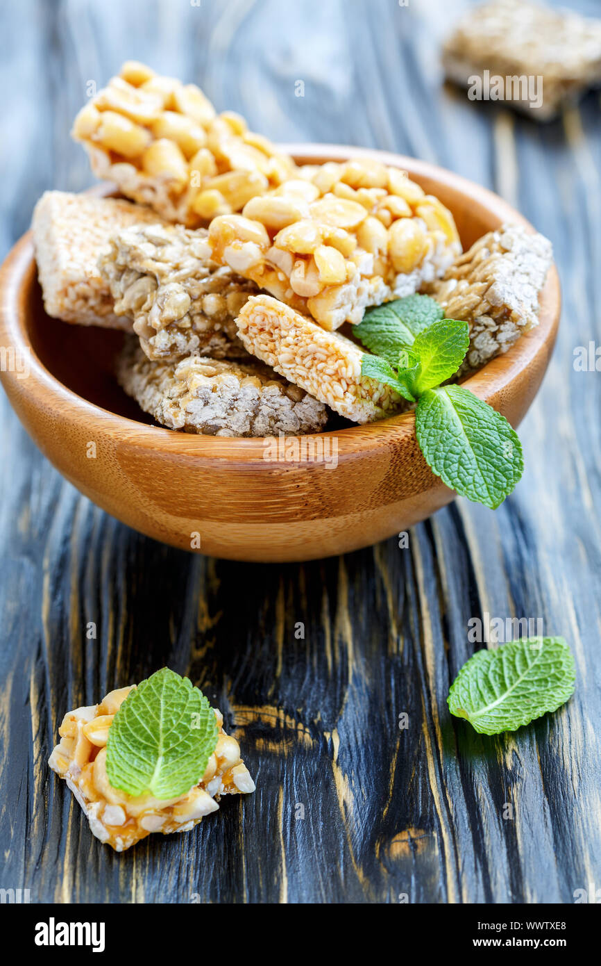 Bowl of honey bars with peanuts, sesame seeds and sunflower seeds. Stock Photo