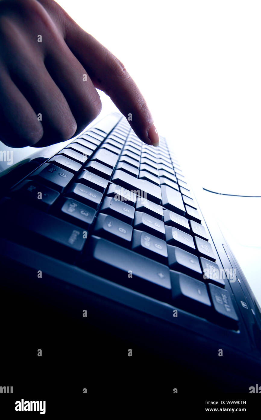 hand press a key on keyboard Stock Photo Alamy