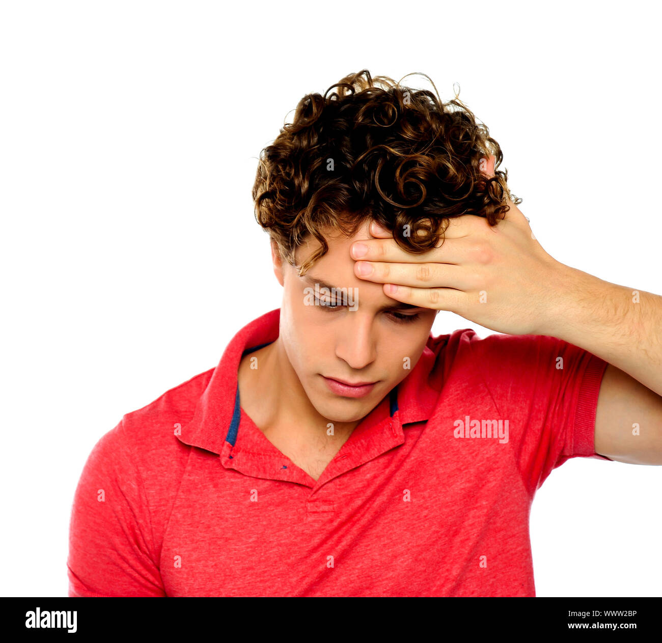 Stressed out guy with hand on his forehead. Sadness and despair Stock
