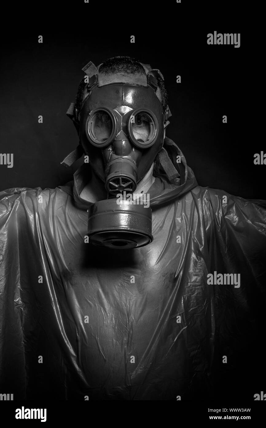 Ebola infection concept, man with red gas mask Stock Photo