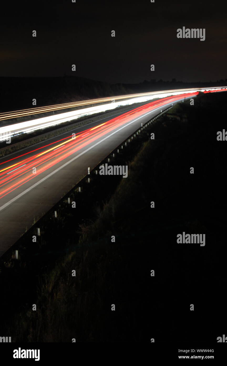 highway at night with car traffic and lights Stock Photo