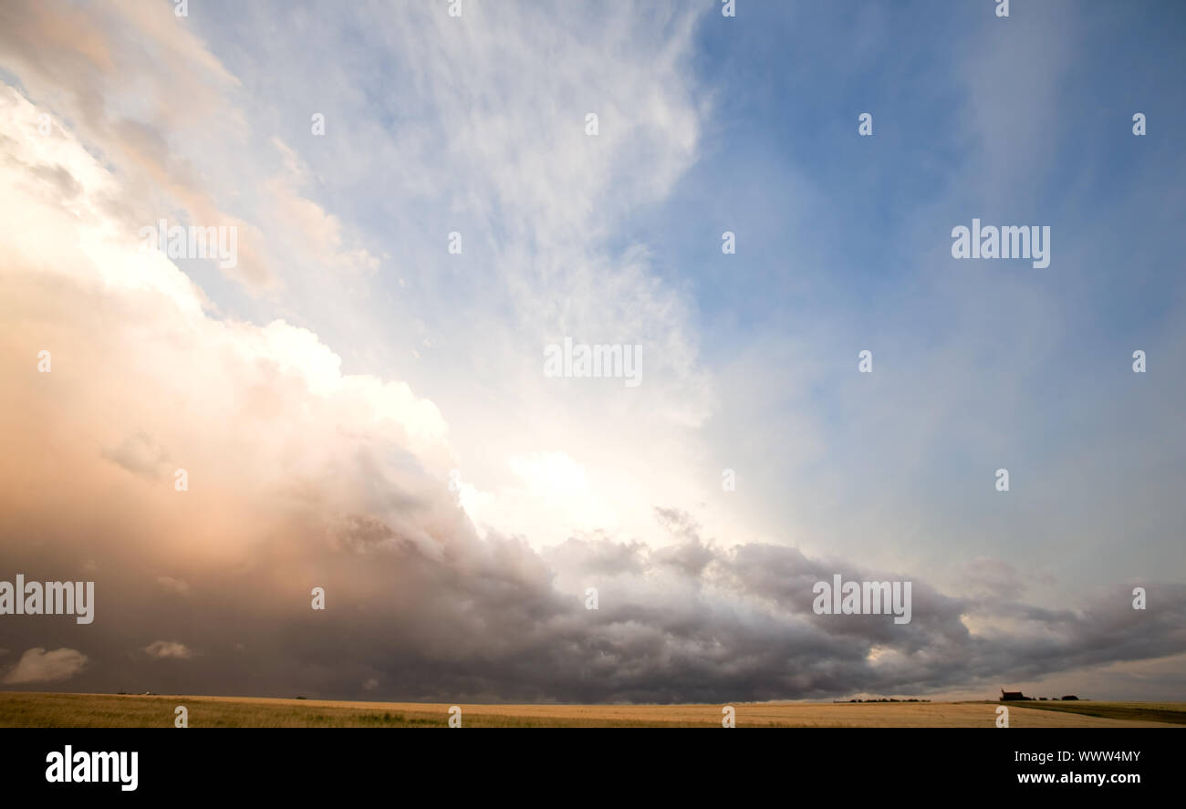 A group of storm clouds hovering above the horizon Stock Photo Alamy