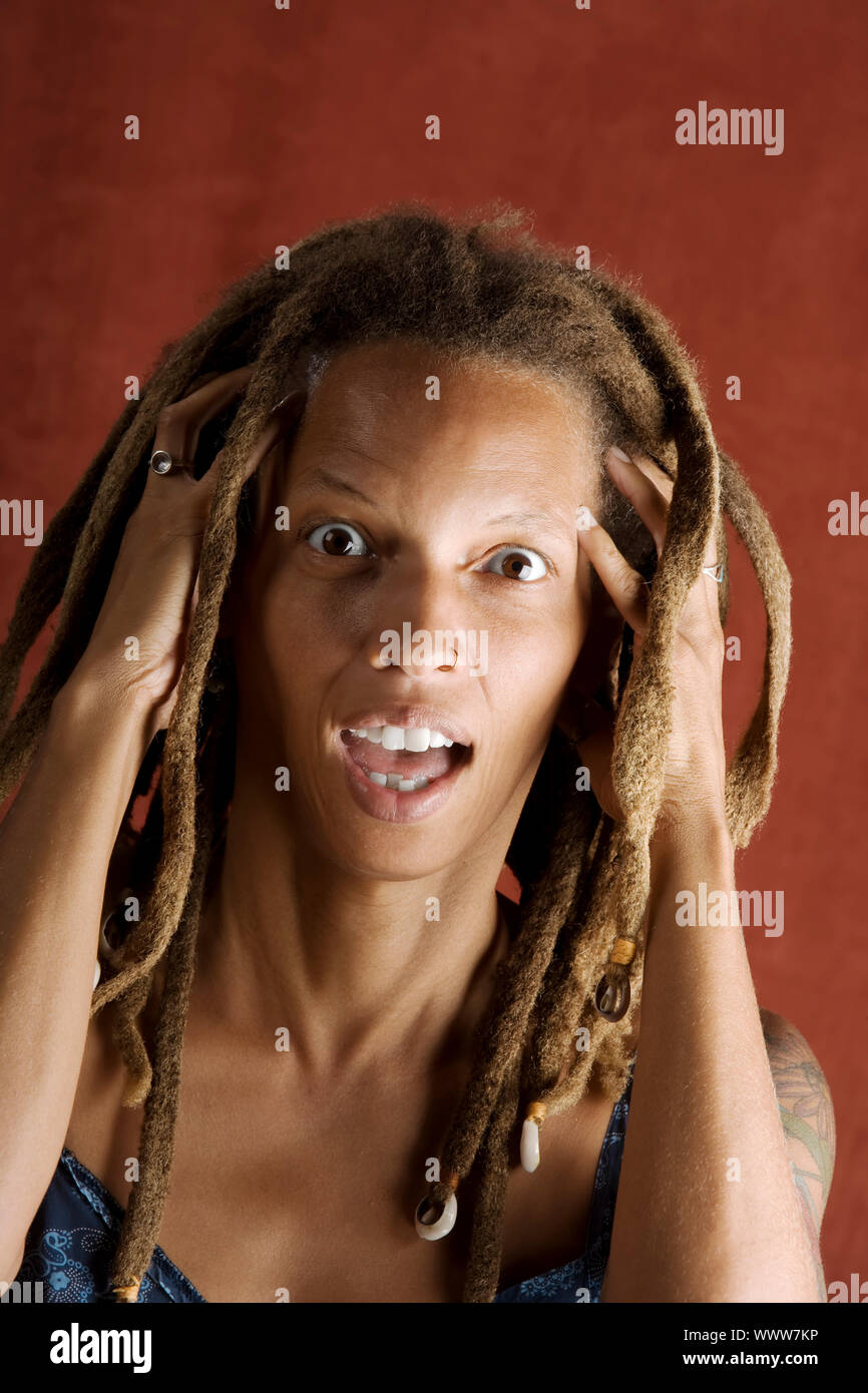 Shocked African American Woman with Hair in Dreadlocks Stock Photo - Alamy