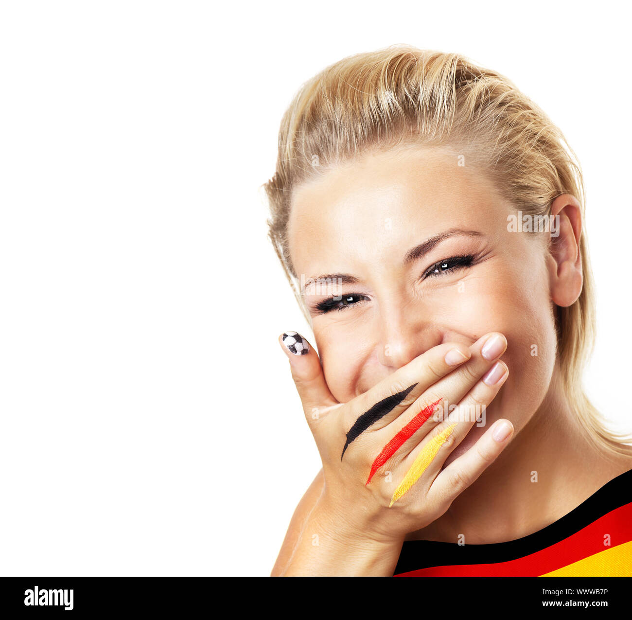 Smiling football fan, closeup on face, female covering mouth with painted in flag colors hand, woman expressing emotions of joy, German team supporter Stock Photo