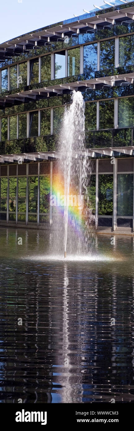 fountain with rainbow in front of IWG Wiesenbusch innovation centre, Gladbeck, Germany, Europe Stock Photo