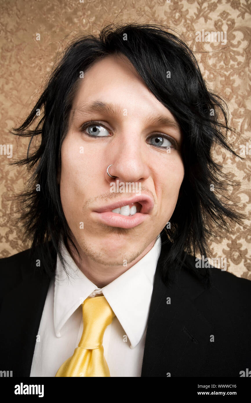 Drunk or angry young man sneering and curling his lip Stock Photo Alamy