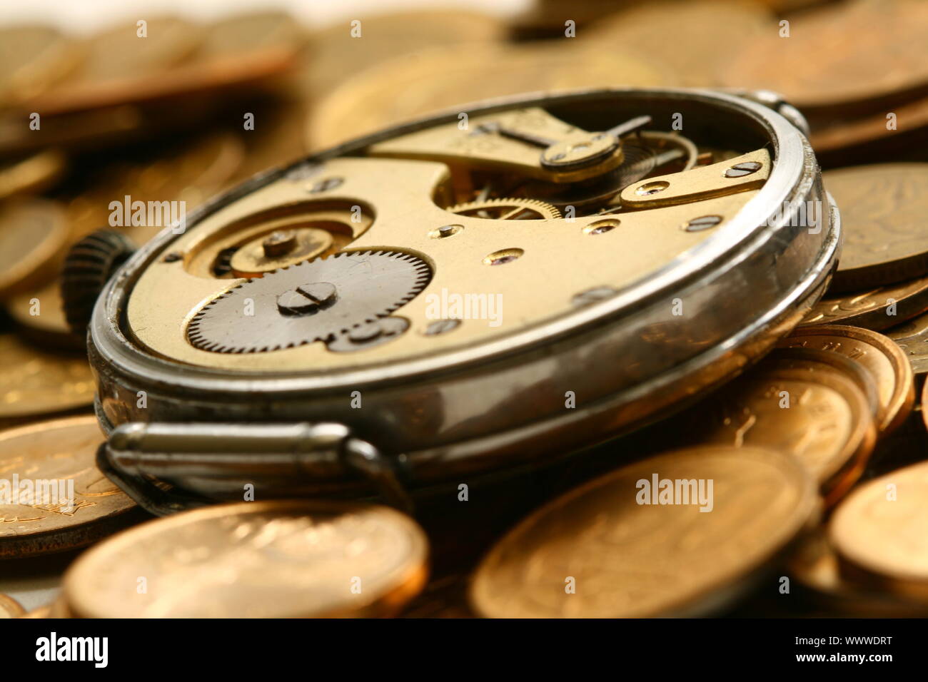 time is money coins and clock macro concet Stock Photo - Alamy