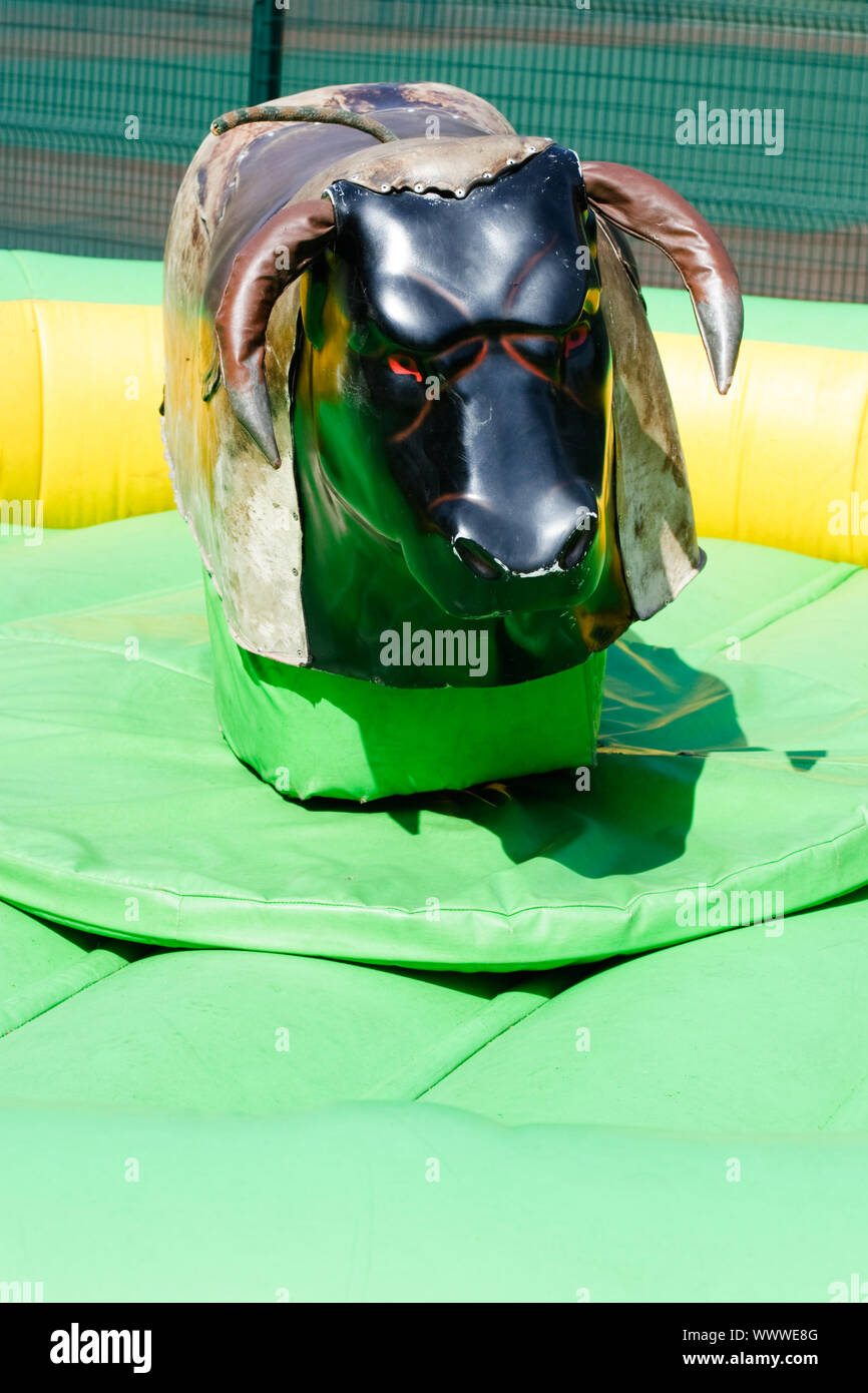 Shabby mechanical bull ride simulator Stock Photo