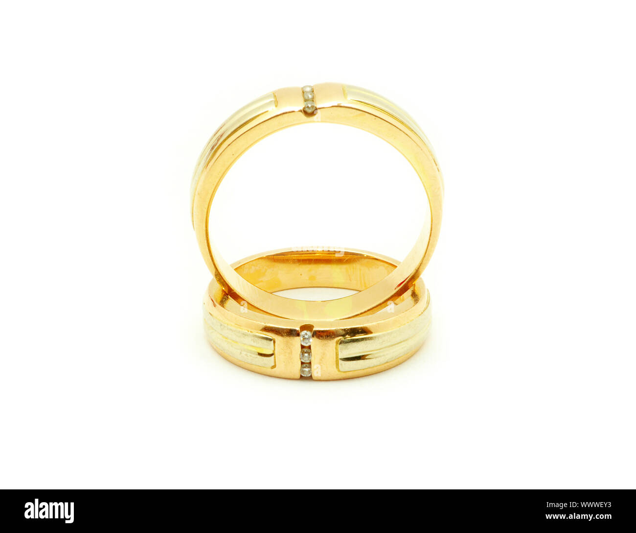 Gold wedding rings isolated on white background Stock Photo - Alamy