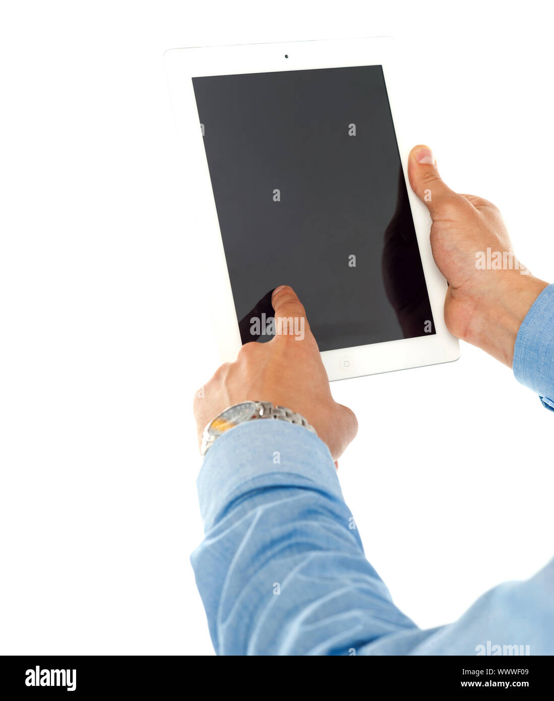 Closeup rear view of a males hand operating touch pad pc Stock Photo