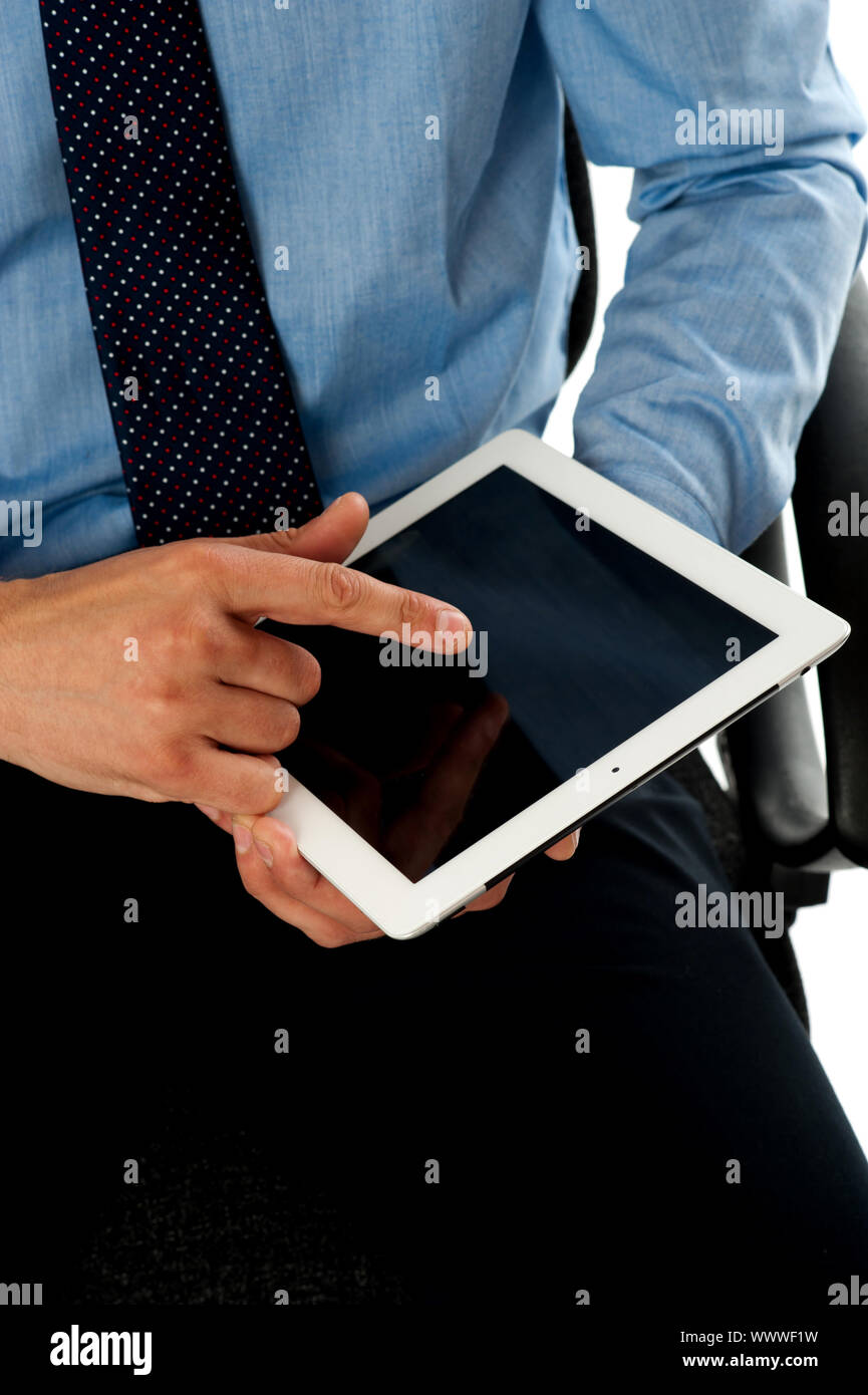 Closeup shot of businessman operating tablet pc using his fingers. Touch screen technology Stock Photo