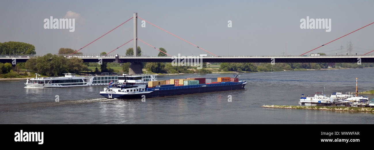 container ship at the brigde over river Rhine, Leverkusen, North Rhine-Westphalia, Germany, Europe Stock Photo