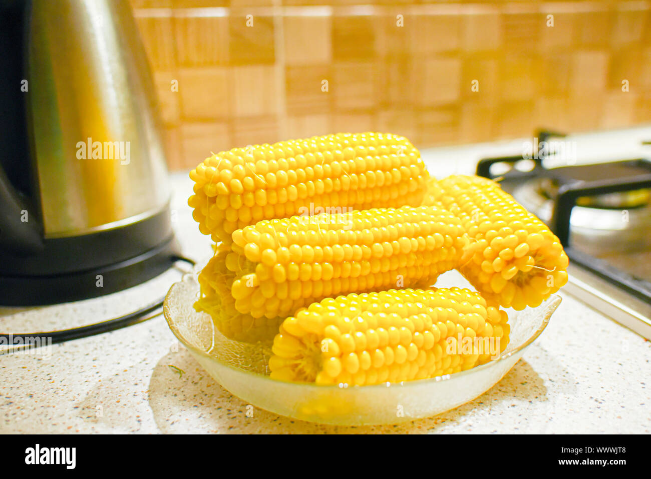 Fresh corn in the kitchen. Corncob. Rustic style. Stock Photo