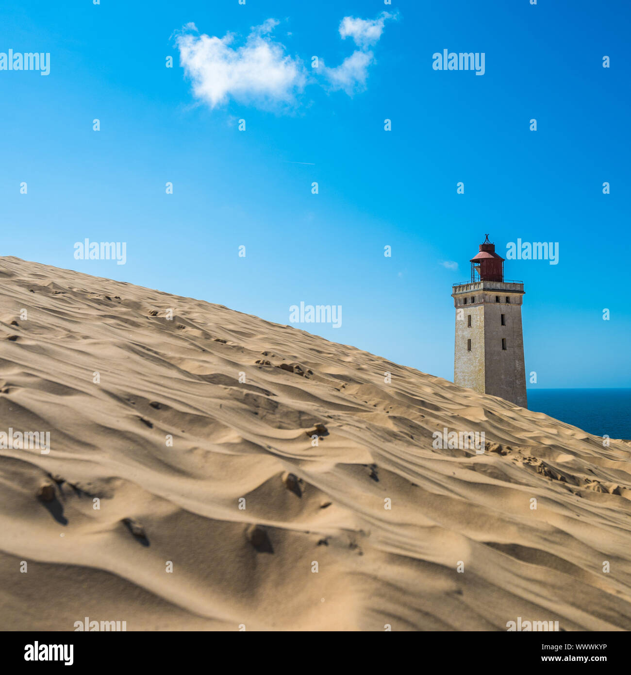 Abandoned Rubjerg Knude Lighthouse and sand dunes, North Sea coast, Denmark Stock Photo