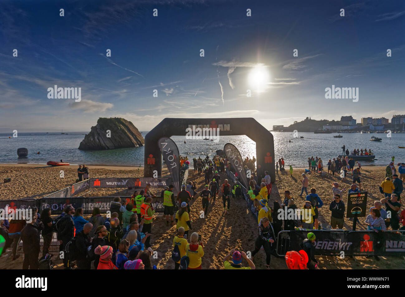 Tenby, UK. 15th Sep, 2019. Pictured: Swimmers at the finish line of the swim event on the north beach. Sunday 15 September 2019 Re: Ironman triathlon event in Tenby, Wales, UK. Credit: ATHENA PICTURE AGENCY LTD/Alamy Live News Stock Photo