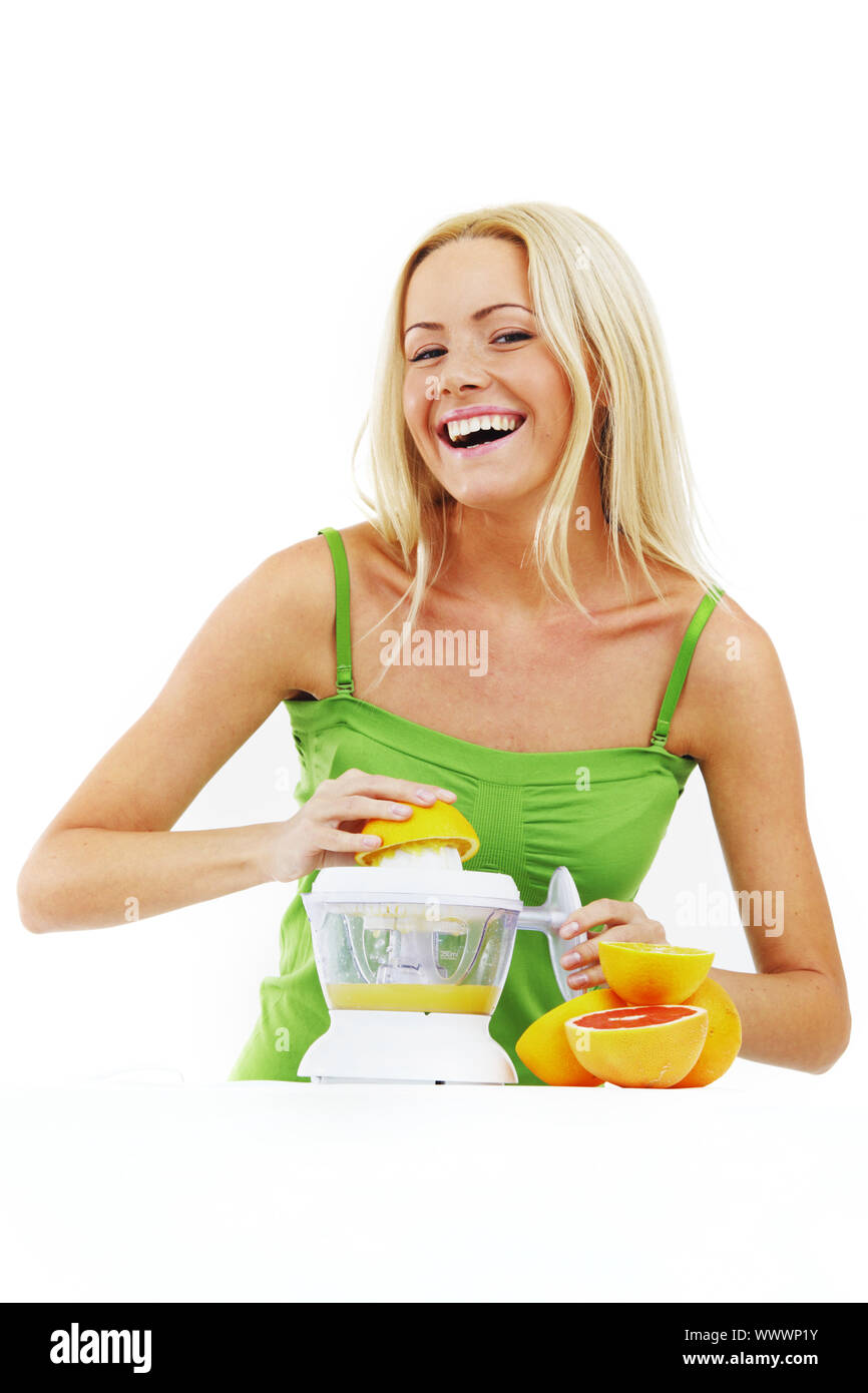fitness woman make an orange juice Stock Photo Alamy