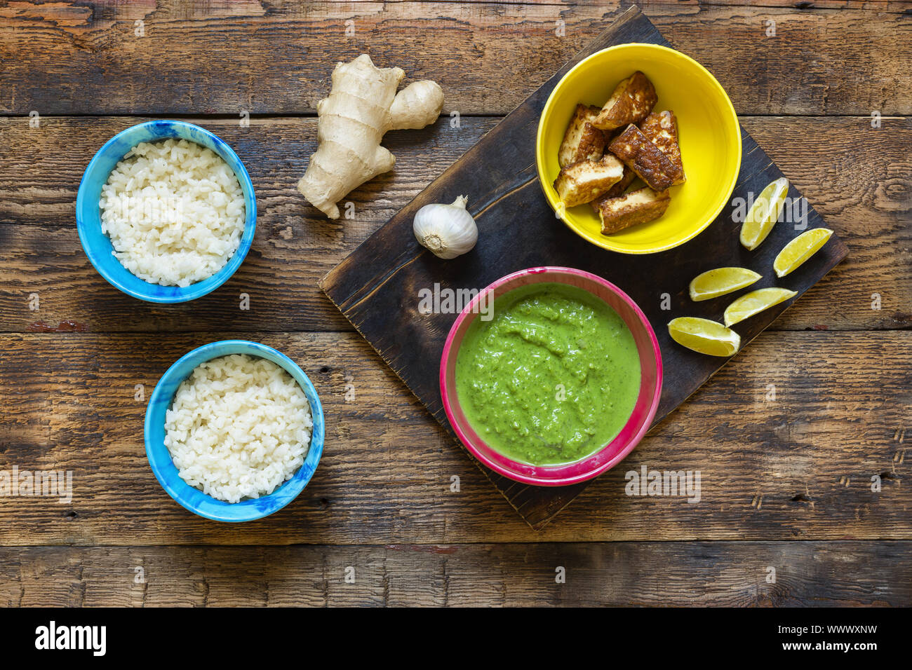 An authentic Indian dinner. Palak paneer and rice. Ginger, spices Stock  Photo - Alamy